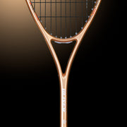 OLIVER APEX 320 CE Squash Racket, copper and black racket on a dark brown background